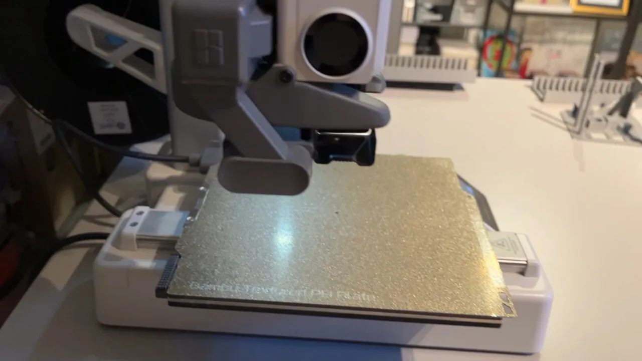 Bambu Lab A1 mini printing on a compact desk