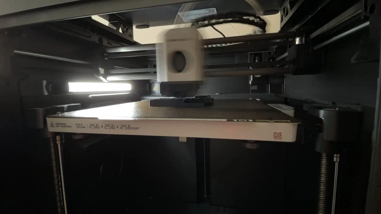 Bambu Lab P1S print head moving above the build plate