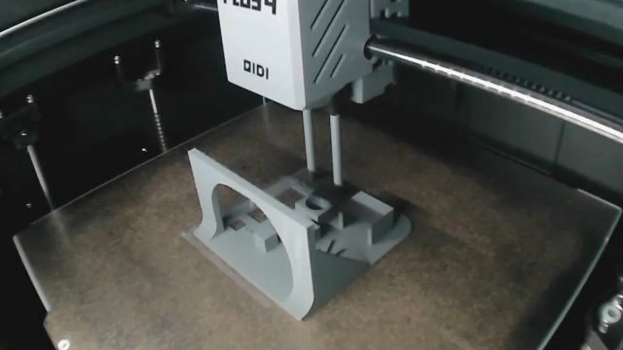 QIDI Plus4 printing a grey functional part inside its chamber